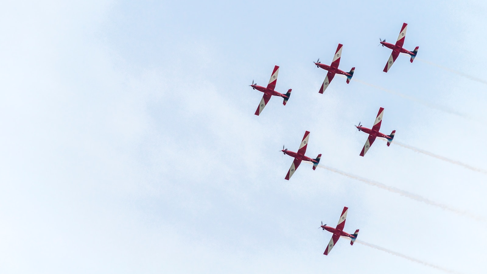 six red planes under white sky during daytime